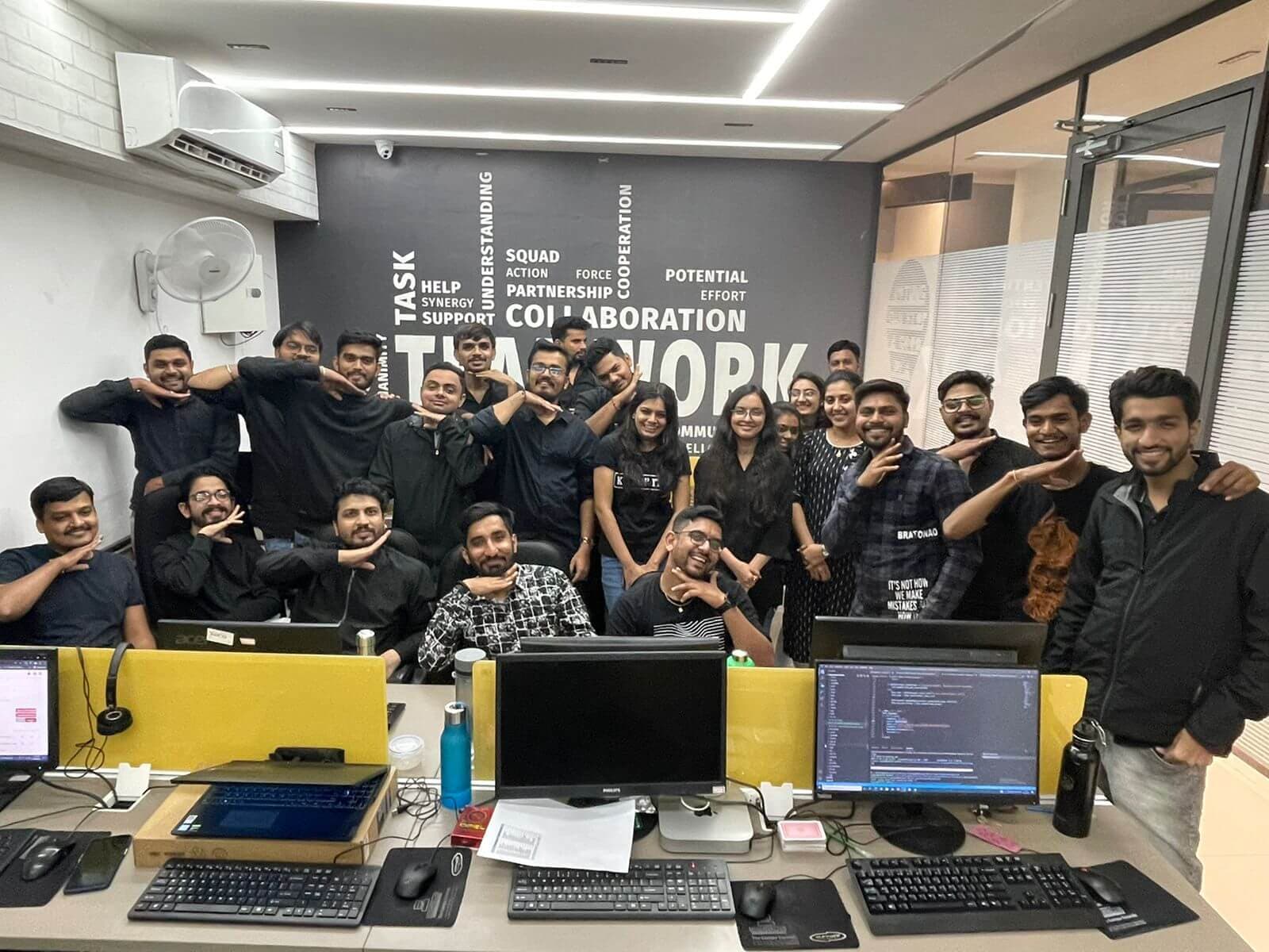 Engross teammates together beside their desks in the office